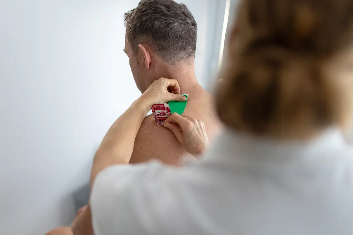 Julie Duff applying RockTape Exeter